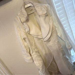 Now this is a must have White very Stylist jacket with a tie belt